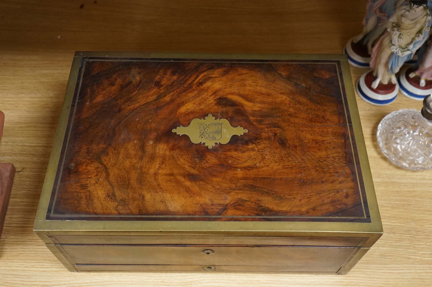 A Regency brass bound mahogany travelling tobacco box, coat of arms to centre, the inner brass cover with cedar wood lining 42.5cm wide